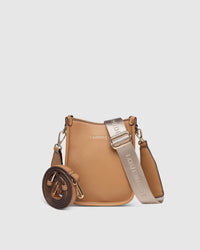 Behind The Trees - Tan handbag with matching strap on a light gray background - Louenhide - Parker Phone Crossbody Bag - Camel