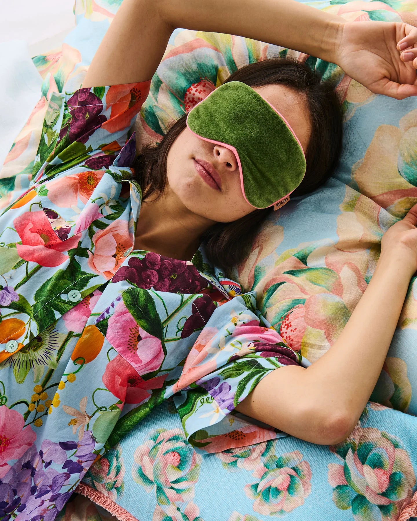 Behind The Trees - Green sleep mask with pink edges on a white background - Kip & Co - Velvet Eye Mask - Moss
