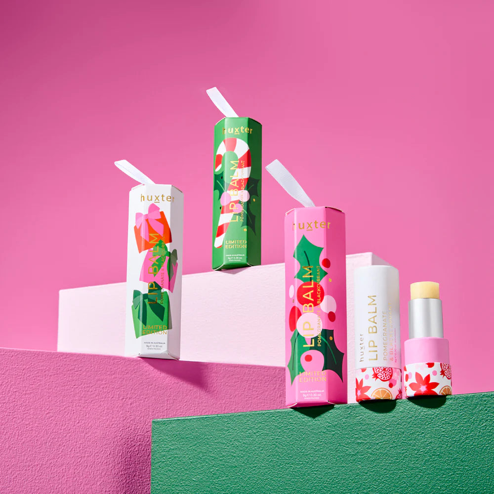 Behind The Trees - Huxter lip balm with floral design on a white background- Huxter - Hanging Lip Balm 9gm - Pomegranate & Blackcurrant - White
