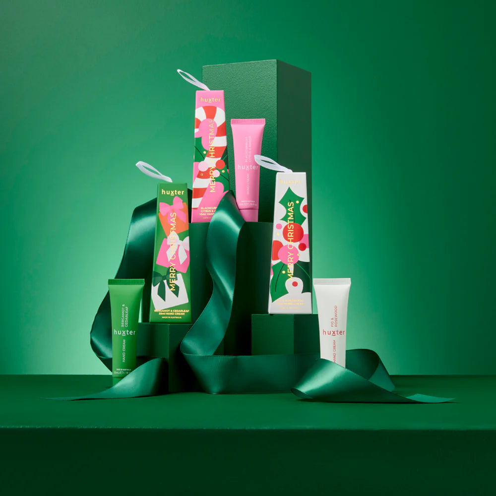 Behind The Trees - Huxter hand cream with a decorative box on a white background - Huxter - Hanging Hand Cream 35ml – Fig & Rosewood