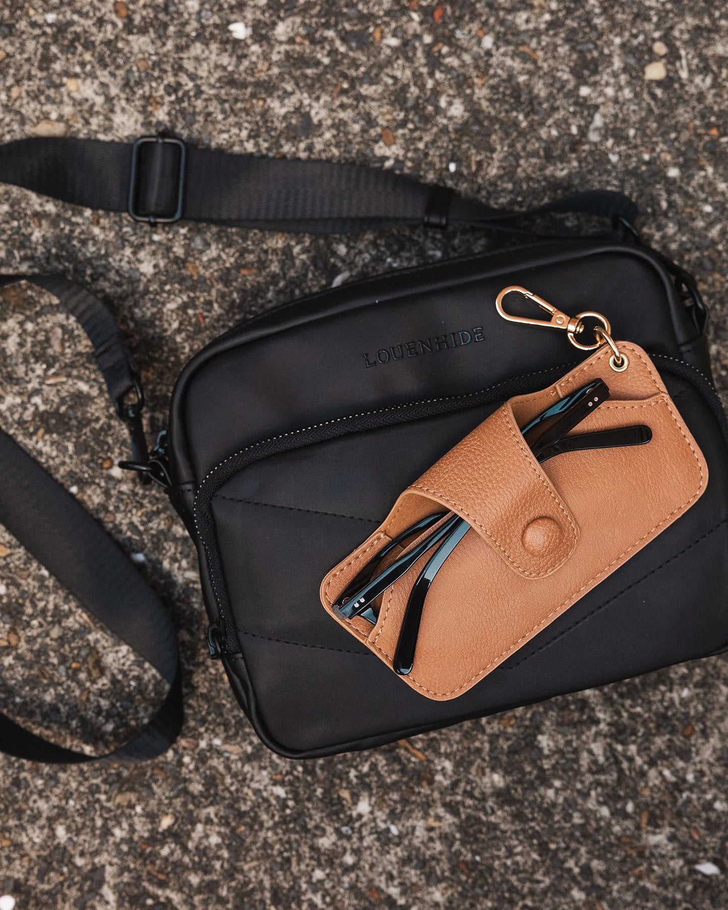 Behind The Trees - Tan leather wallet with a keychain on a light gray background - Louenhide - Skittle Sunglass Case - Camel