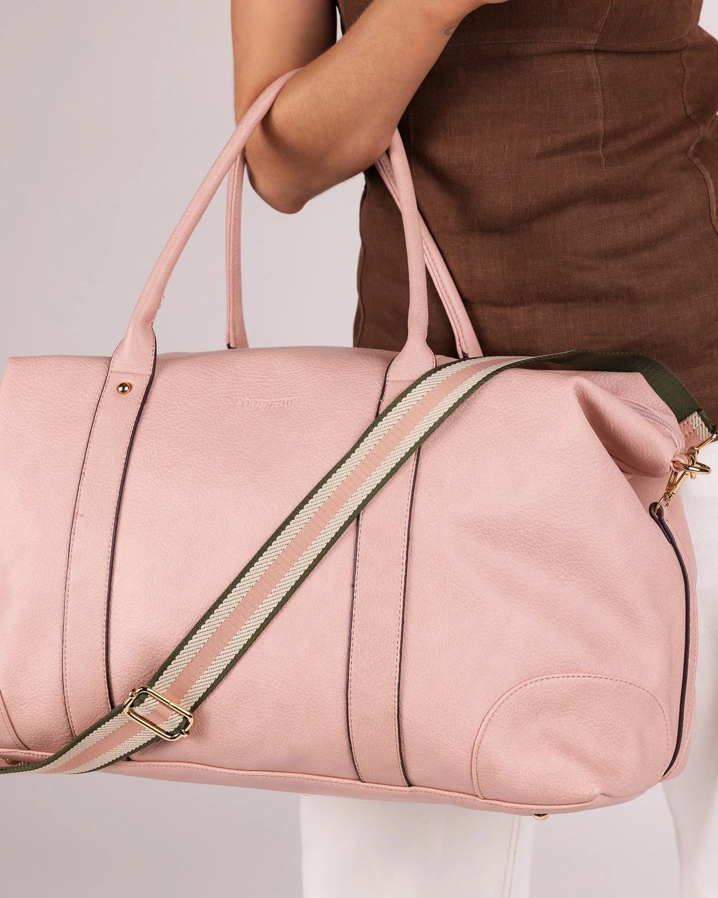 Behind The Trees - Pink travel bag with wheels on a light gray background - Louenhide - Alexis Stripe Weekender Travel Bag - Blush Stripe