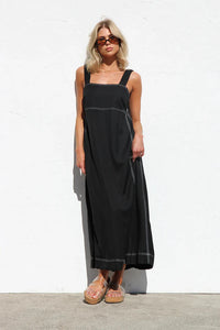 Behind The Trees - Woman wearing a black dress with straps on a white background - Label Of Love - Stitched Up Maxi Dress - Black