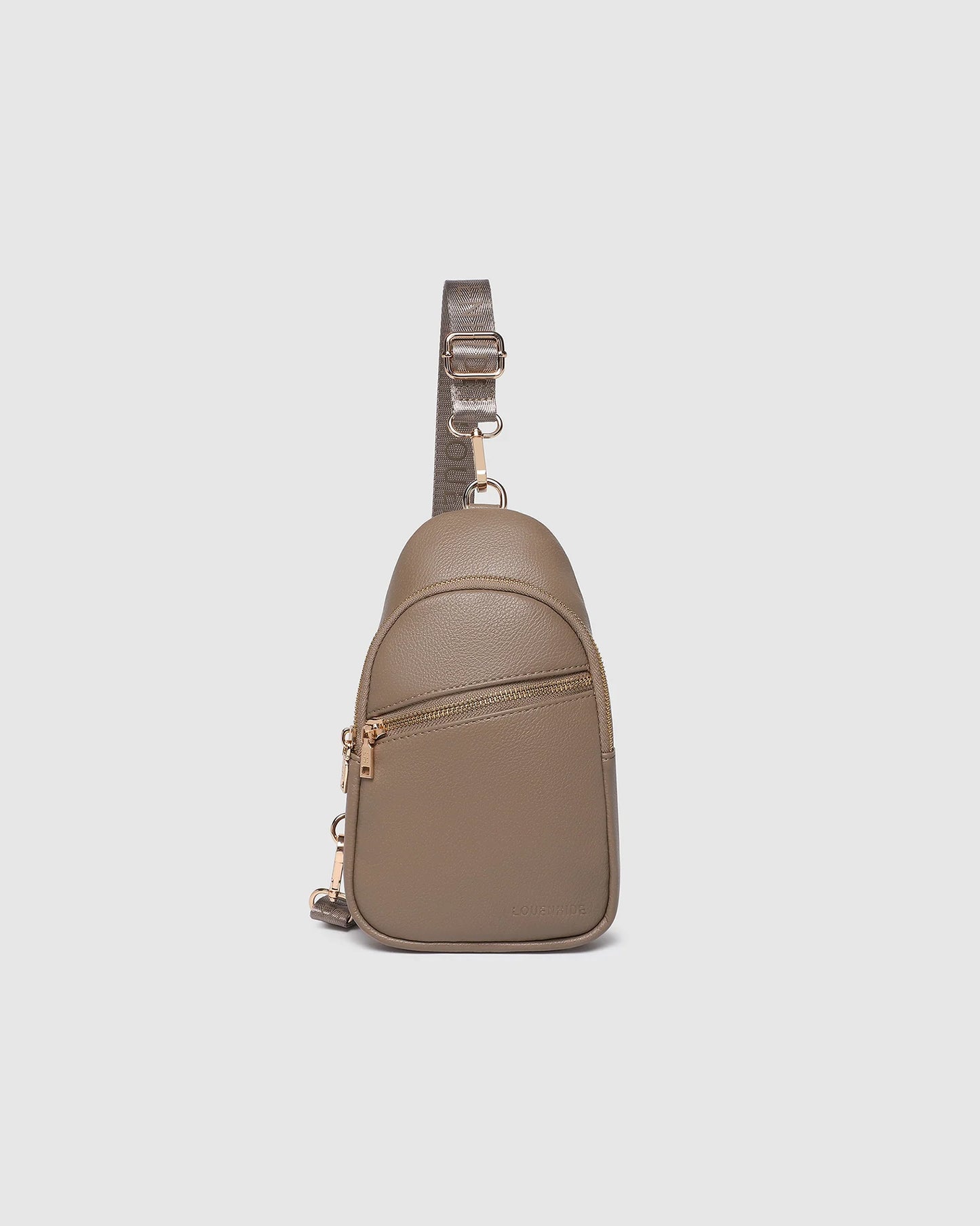 Behind The Trees - Beige leather sling bag on a light gray background - Louenhide - Baby Bella Sling Bag - Mocha