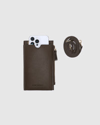 Behind The Trees - Brown leather wallet with phone pocket and detachable strap on a light gray background - Louenhide - Suki Phone Bag - Chocolate