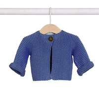 Behind The Trees - Blue knitted baby cardigan on a hanger against a white background - DLUX - Baby Elf Knitted Cardigan - Denim