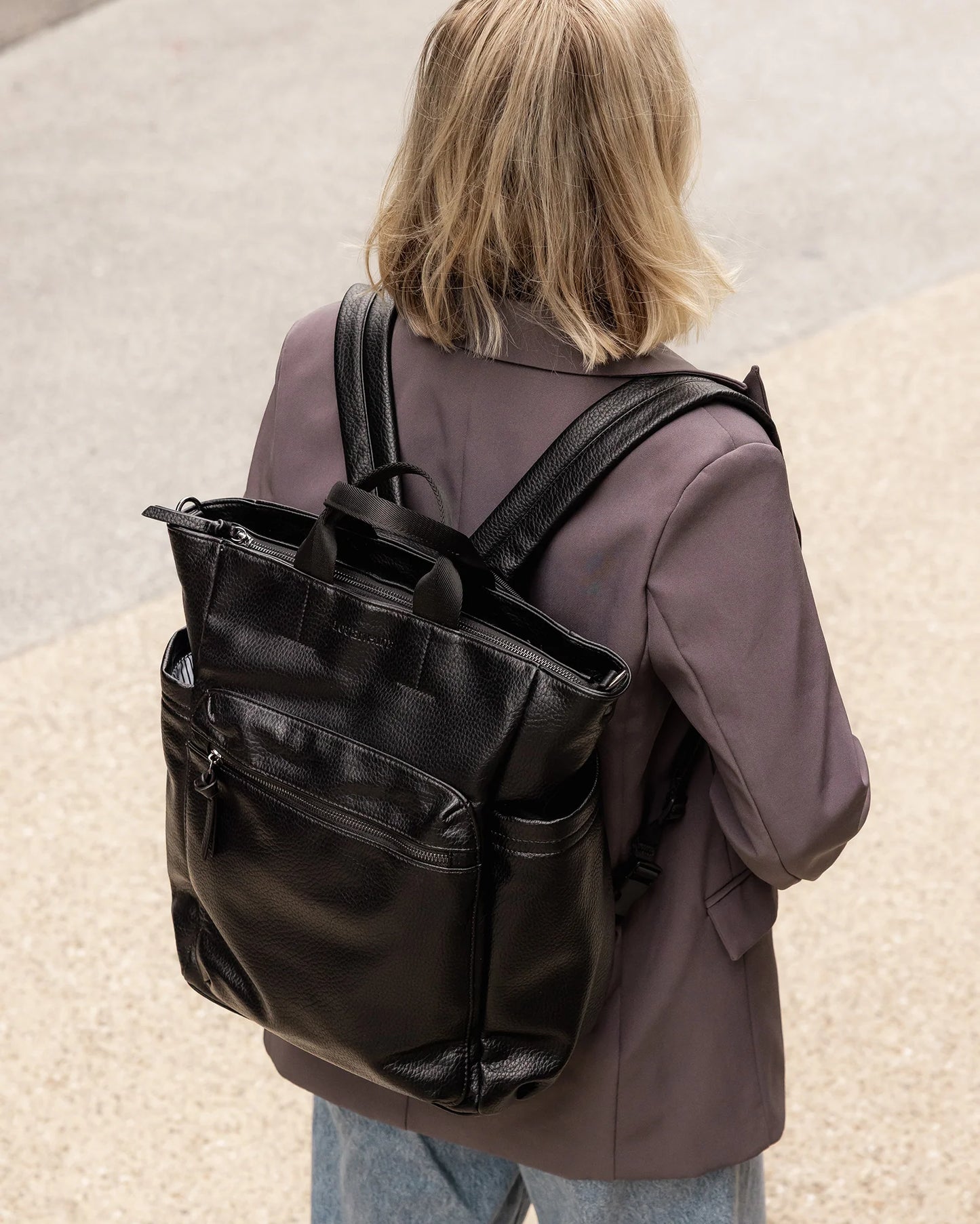 Behind The Trees - Black backpack on a light gray background - Louenhide - Bronx Backpack - Black