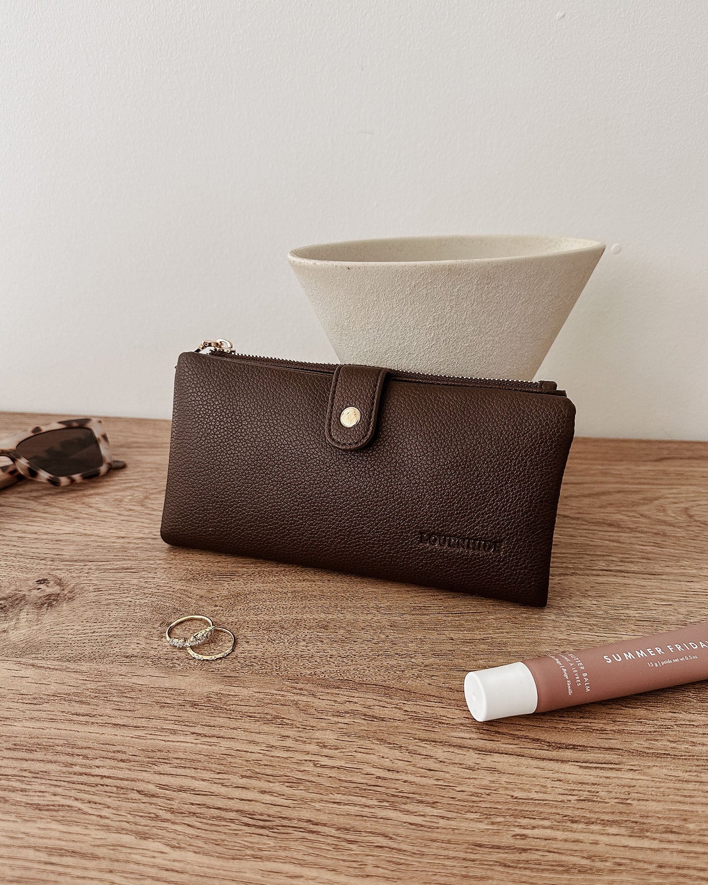 Behind The Trees - Brown wallet with card slots and coin pouch on a wooden surface - Louenhide - Stella Wallet - Chocolate