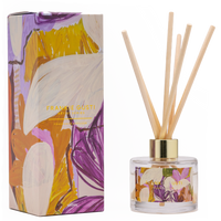 Behind The Trees - Reed diffuser with floral packaging and decorative sticks on a white background - Frankie Gusti - Diffuser - Artist Series - Kate Mayes - Flower Bomb