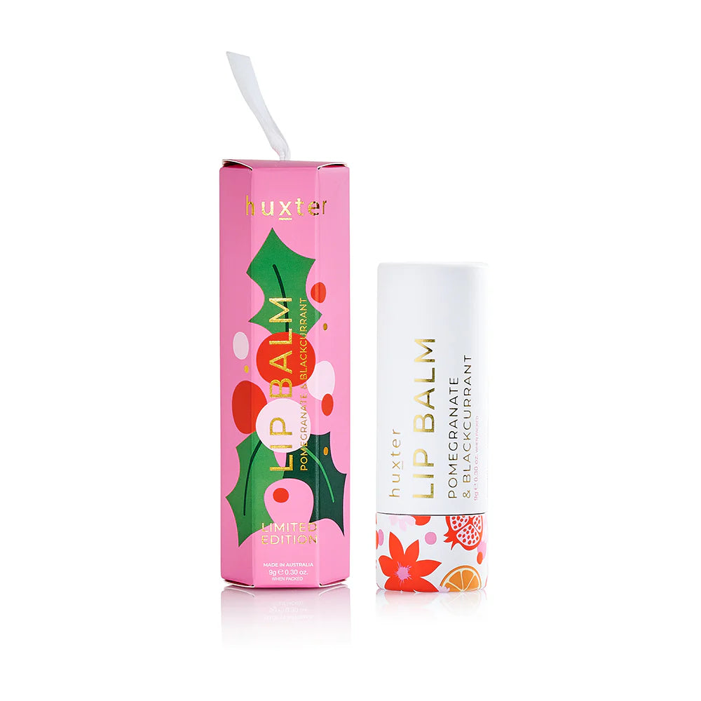 Behind The Trees - Lip balm with pink packaging featuring floral designs on a white background - Huxter - Hanging Lip Balm 9gm - Pomegranate & Blackcurrant - Pink
