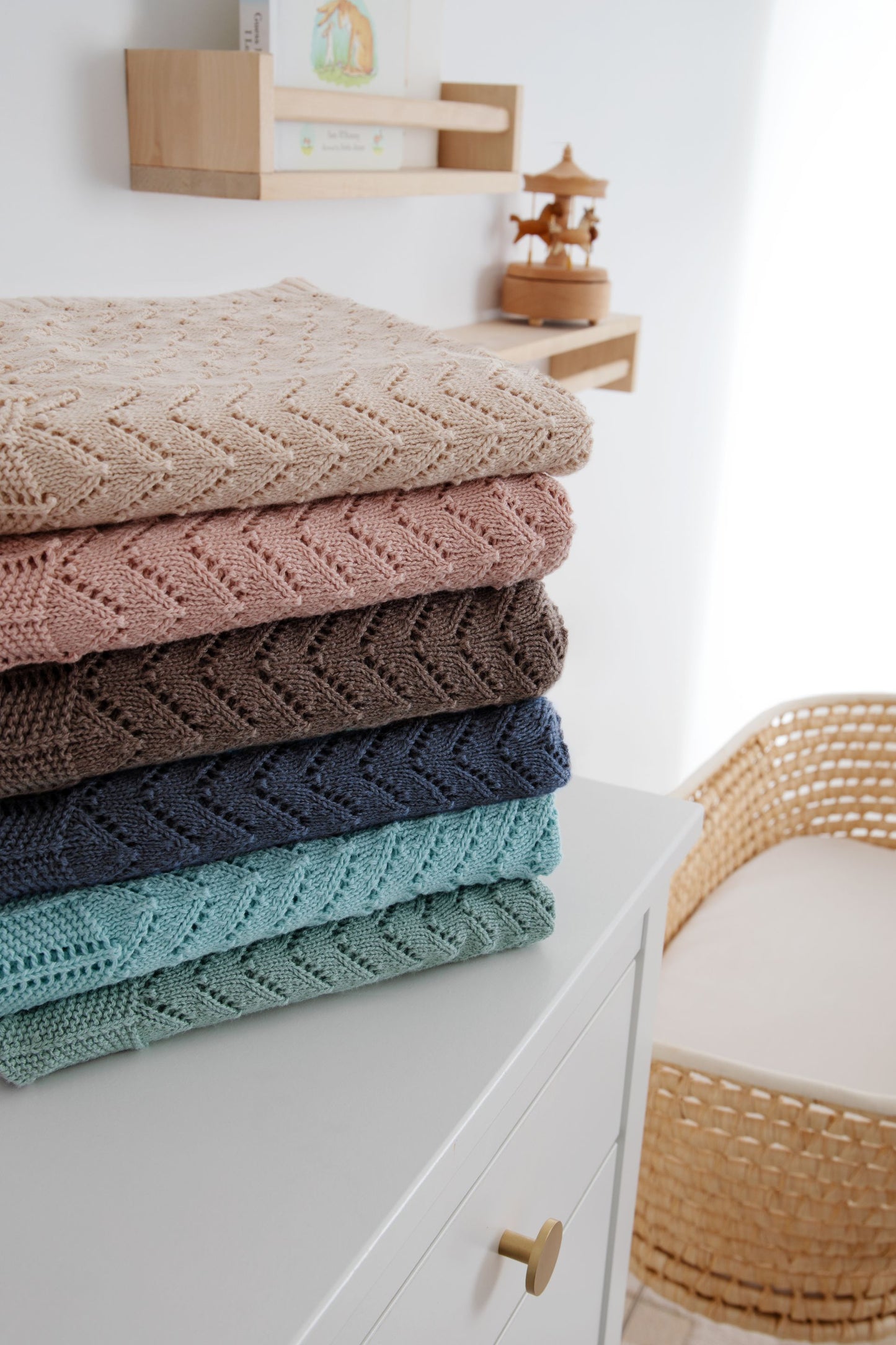 Behind The Trees - Light blue textured blanket draped over a wooden rod against a light background - DLUX - Mica Chevron Pointelle Knit Baby Blanket - Duck Egg