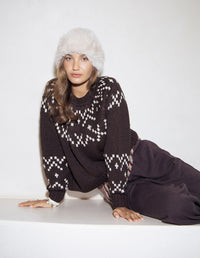 Behind The Trees - Woman wearing a dark sweater with a white pattern and a white beanie on a white background - Foxwood - Polar Knit Crew - Coffee