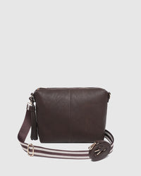 Behind The Trees - Brown leather crossbody bag with a strap on a light gray background - Louenhide - Daisy Stripe Crossbody Bag - Chocolate