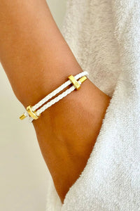 Behind The Trees - Bracelet with gold clasps on a wrist against a white background - Mosk.Melbourne - White Rope Bracelet