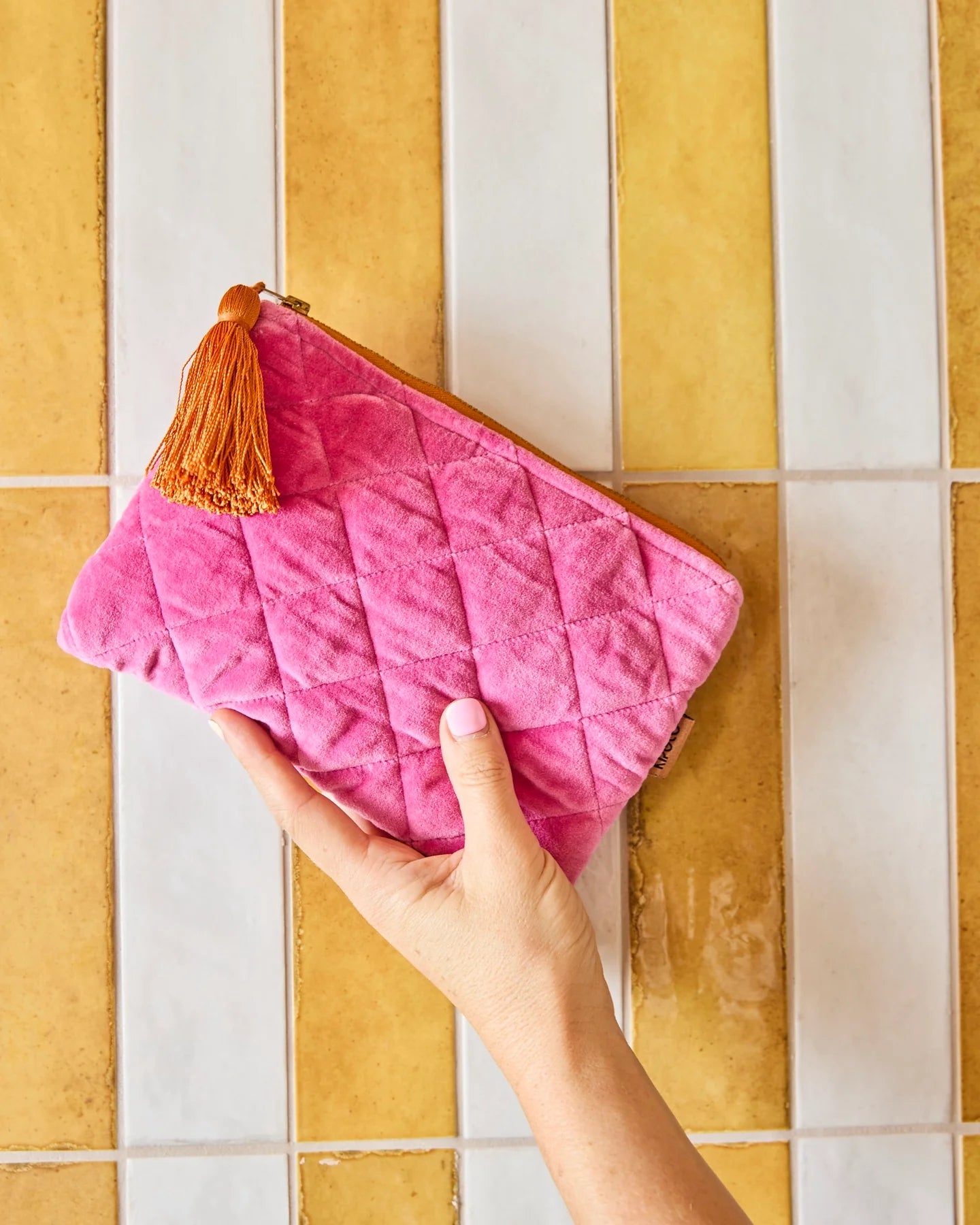 Behind The Trees - Pink quilted pouch with a tassel on a white background - Kip & Co - Velvet Cosmetics Purse - Pink