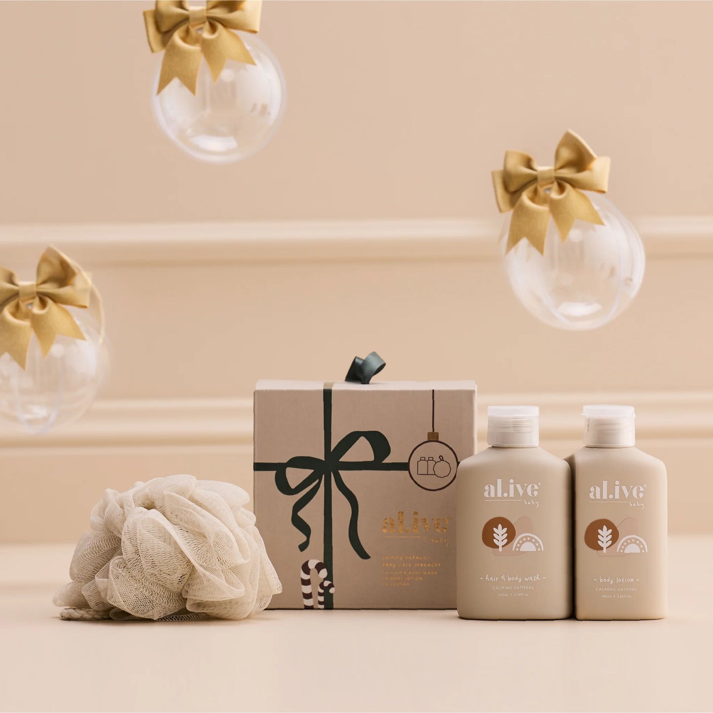 Behind The Trees - Set of 'alive' skincare products including bottles and a bath pouf on a white background - Al. Ive - Baby Care Ornament - Calming Oatmeal