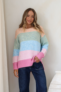 Behind The Trees - Woman wearing a colorful striped sweater against a plain background - Miss Marlow - Cali Multi Stripe Knit - Mango/Sage/Blue/Pink
