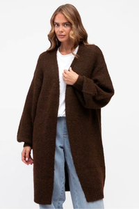 Behind The Trees - Woman wearing a brown coat over a white shirt and light blue jeans on a white background - Label Of Love - Casey Longline Cardigan - Chocolate