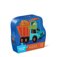 Behind The Trees - Puzzle packaging with a cartoon truck and dinosaur on a blue background - Crocodile Creek - Mini Puzzle 12 pc - Construction Croc