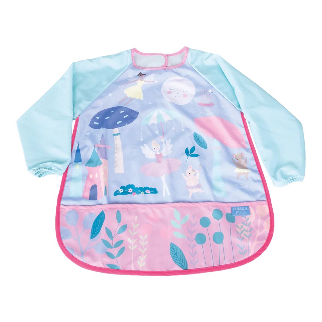 Behind The Trees - Packaged playtime apron with colorful design on a white background - Floss &amp; Rock - Playtime Apron - Enchanted