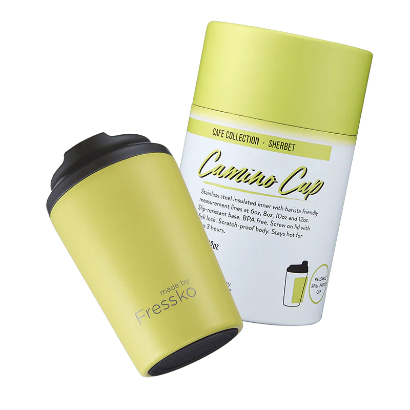 Behind The Trees - Yellow travel mug with black lid and white label on a white background - Made By Fresko - Reusable Coffee Cup - Camino 340ml/12oz - Sherbet