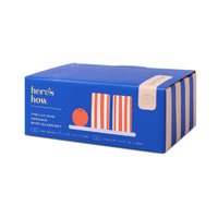 Behind The Trees - Blue box with 'here's how' branding and product illustration on a white background - Here's How - The Lily Mae Ceramic Tequila Shot Glass Set w/ Tray and Shaker - Poppy + Lilac