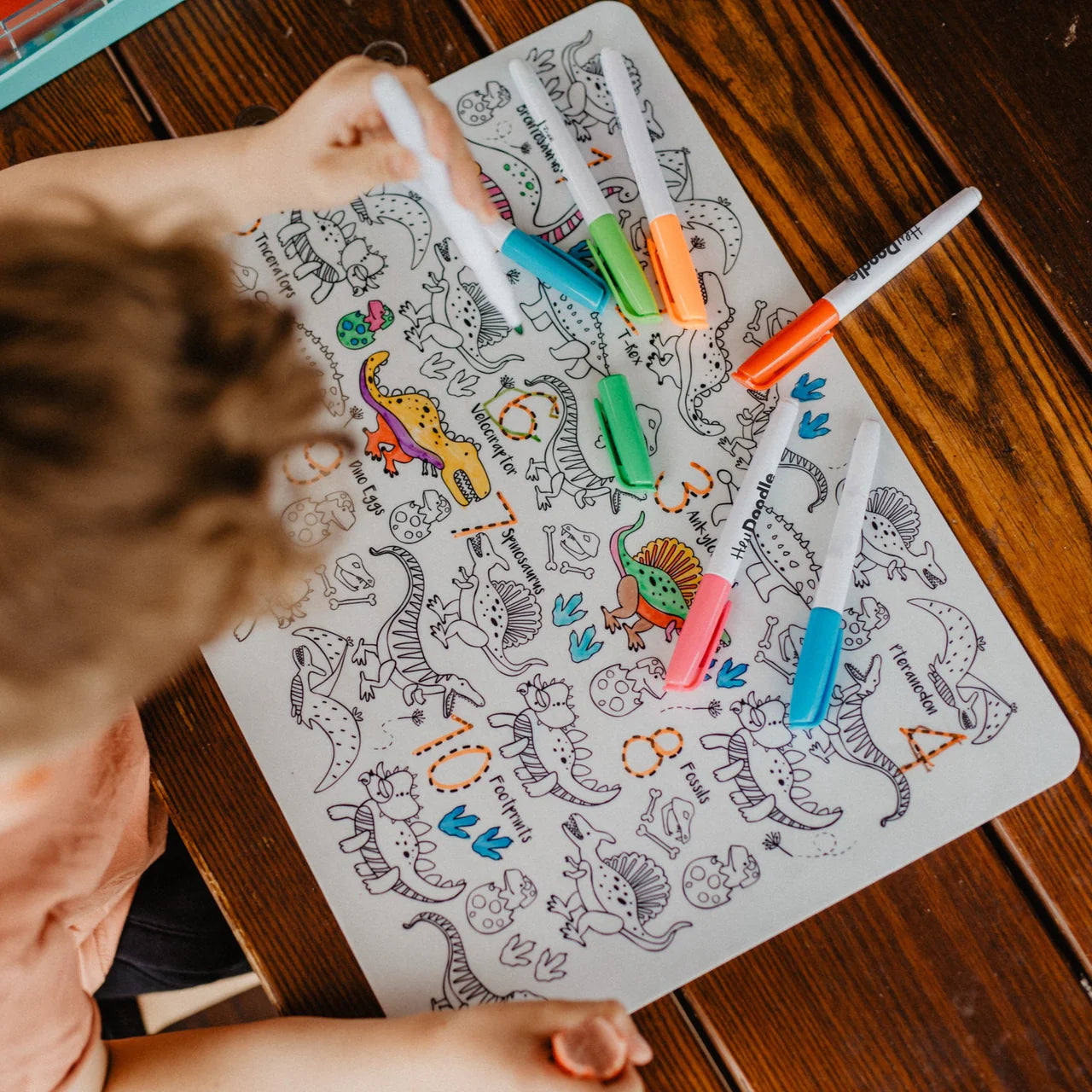 Behind The Trees - Hey Doodle dinosaur-themed coloring set with reusable silicone mat and markers on a white background. - Hey Doodle - Classic Colouring & Doodle Mat - DinoRoar