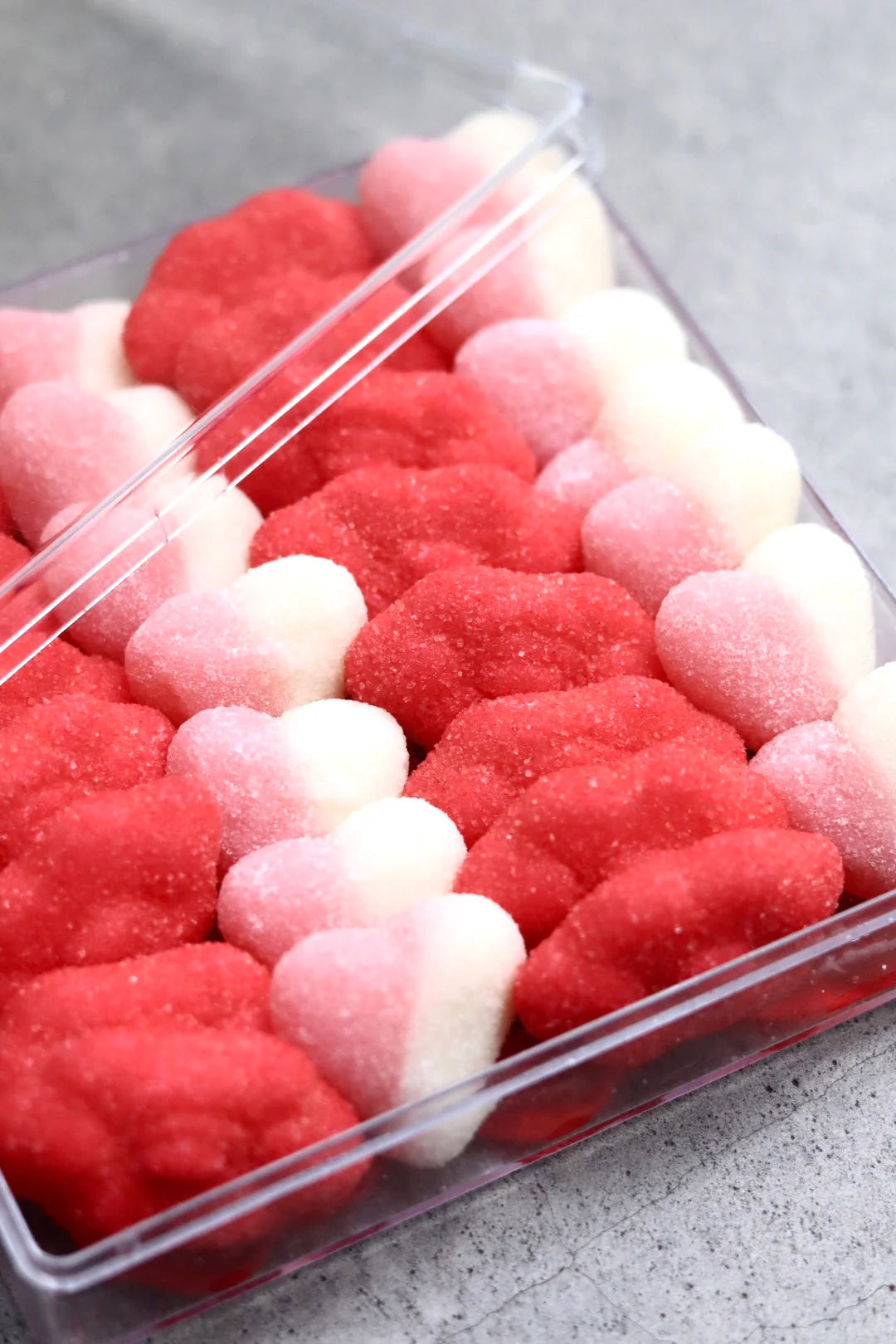 Behind The Trees - Pink box of red and white gummy bears with 'SWEETA' branding on a gray background - Sweeta - Gummy Platter - Ruby Kiss 280g