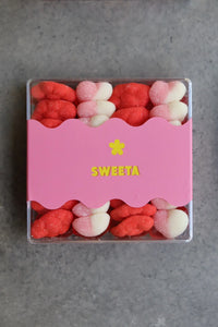 Behind The Trees - Pink box of red and white gummy bears with 'SWEETA' branding on a gray background - Sweeta - Gummy Platter - Ruby Kiss 280g
