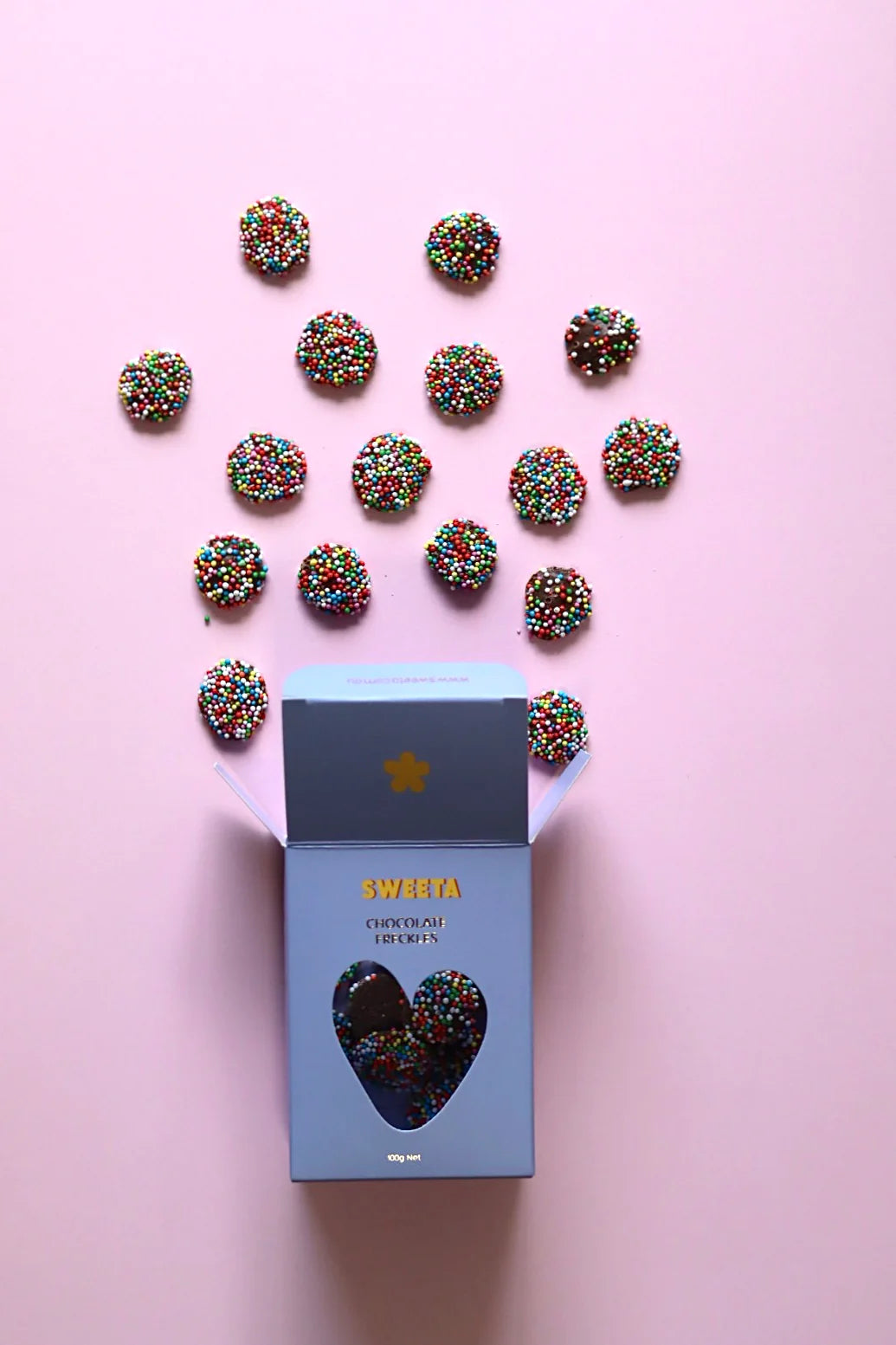 Behind The Trees - Box of Sweets with colorful sprinkles and chocolate truffles on a table. - Sweeta - Chocolate Freckles 100g