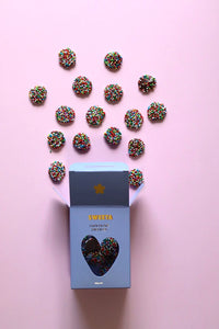 Behind The Trees - Box of Sweets with colorful sprinkles and chocolate truffles on a table. - Sweeta - Chocolate Freckles 100g