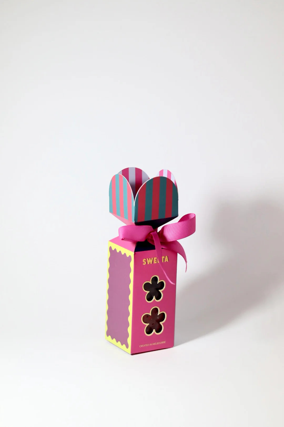 Behind The Trees - Pink gift box with striped bow on a white background - Sweeta - Rock Candy Gift Box