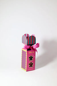Behind The Trees - Pink gift box with striped bow on a white background - Sweeta - Rock Candy Gift Box