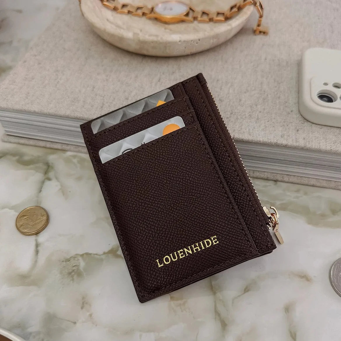 Behind The Trees - Black leather wallet with gold zipper and 'LORENWIL' branding on a light gray background - v