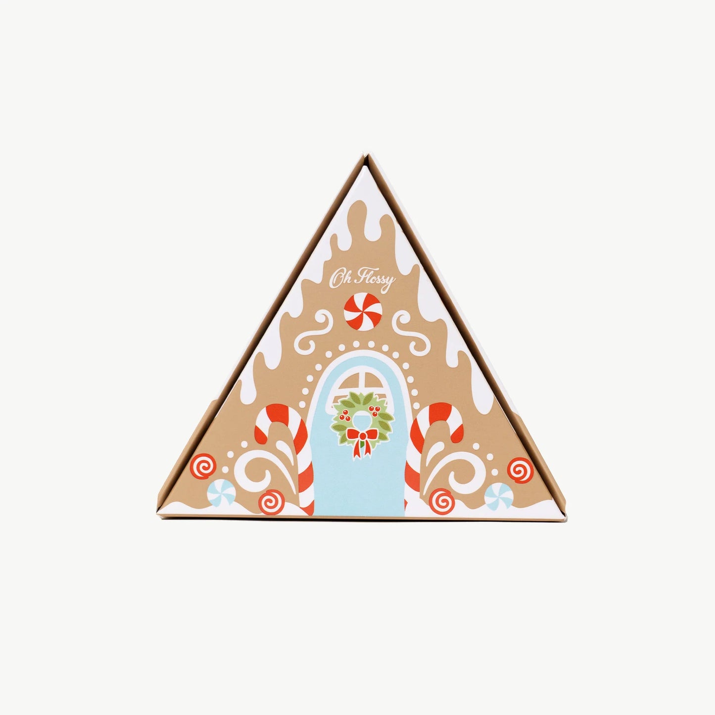 Behind The Trees - Set of Oh Flossy products including a pink jar, a bottle, and a box on a white background- Oh Flossy - Christmas Gingerbread House Mini Mani Set