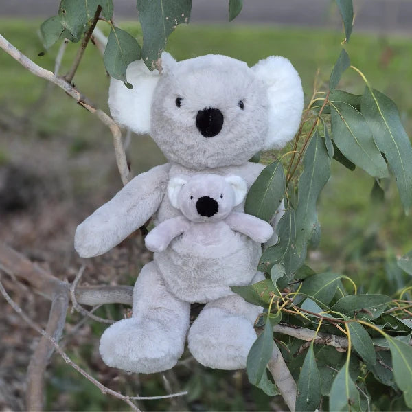 Behind The Trees - Plush koala toy sitting on a branch with green leaves - Petite Vous - Soft Toy - Kimiko Koala & Kip