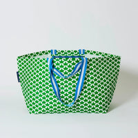 Behind The Trees - Green and white patterned tote bag with blue handles on a light gray background - Project Ten - Oversized Tote - Boats