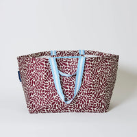 Behind The Trees - Red patterned tote bag with blue handles on a white background - Project Ten - Oversized Tote - Coral