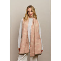 Behind The Trees - Woman wearing a light pink scarf with a subtle pattern against a beige background - Tiger Tree - Petite Fleur Scarf - Pink