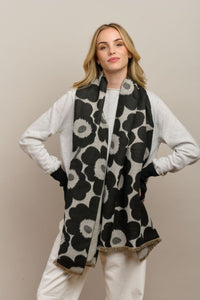 Behind The Trees - Woman wearing a black and white floral patterned scarf against a plain background - Tiger Tree - Tall Poppy Scarf - Black