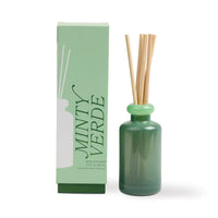 Behind The Trees - Green diffuser bottle with reeds and packaging labeled 'Minty Verde' on a white background - Designworks - Stacked 3.2 FL OZ (94ml) Glass Diffuser w/ Bright Green Lid and Dark Green Base - Minty Verde