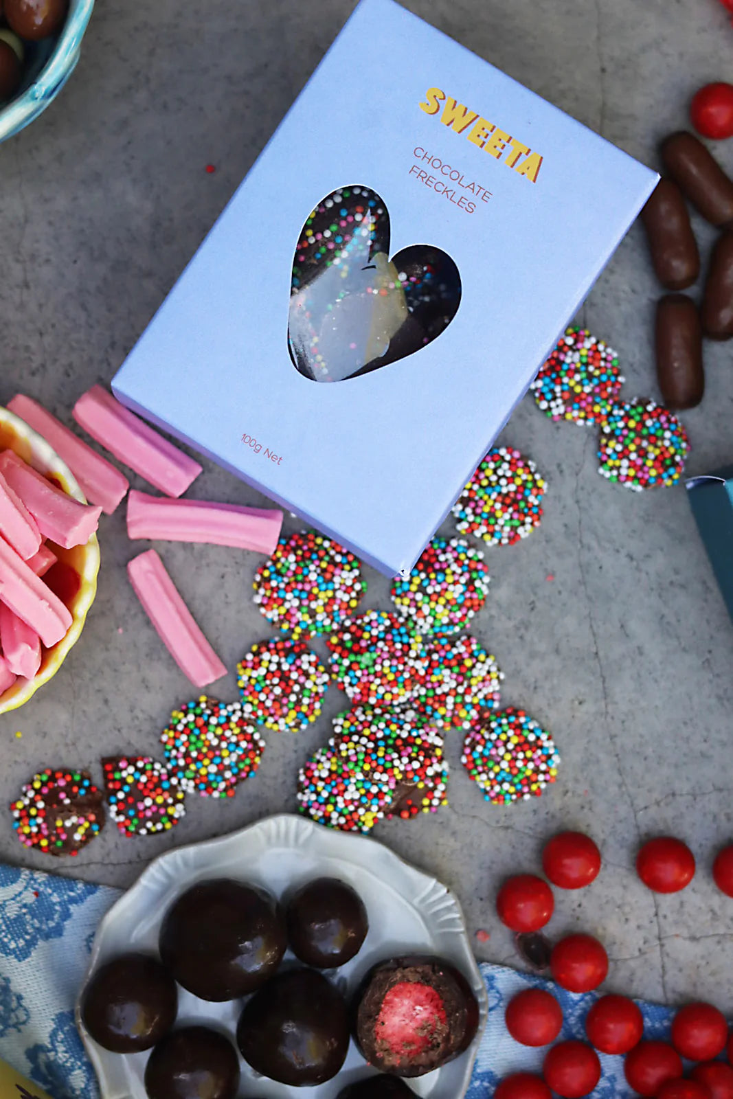 Behind The Trees - Box of Sweets with colorful sprinkles and chocolate truffles on a table. - Sweeta - Chocolate Freckles 100g