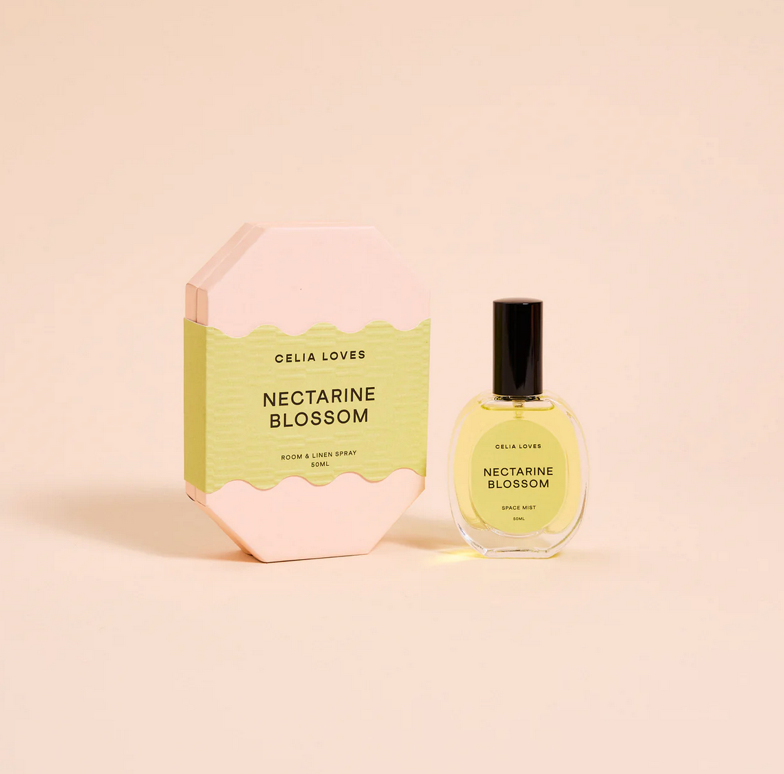 Behind The Trees - Celia Loves Nectarine Blossom room and body spray bottle and packaging on a beige background - Celia Loves - Room Spray 50ml - Nectarine Blossom
