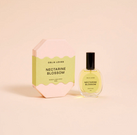 Behind The Trees - Celia Loves Nectarine Blossom room and body spray bottle and packaging on a beige background - Celia Loves - Room Spray 50ml - Nectarine Blossom