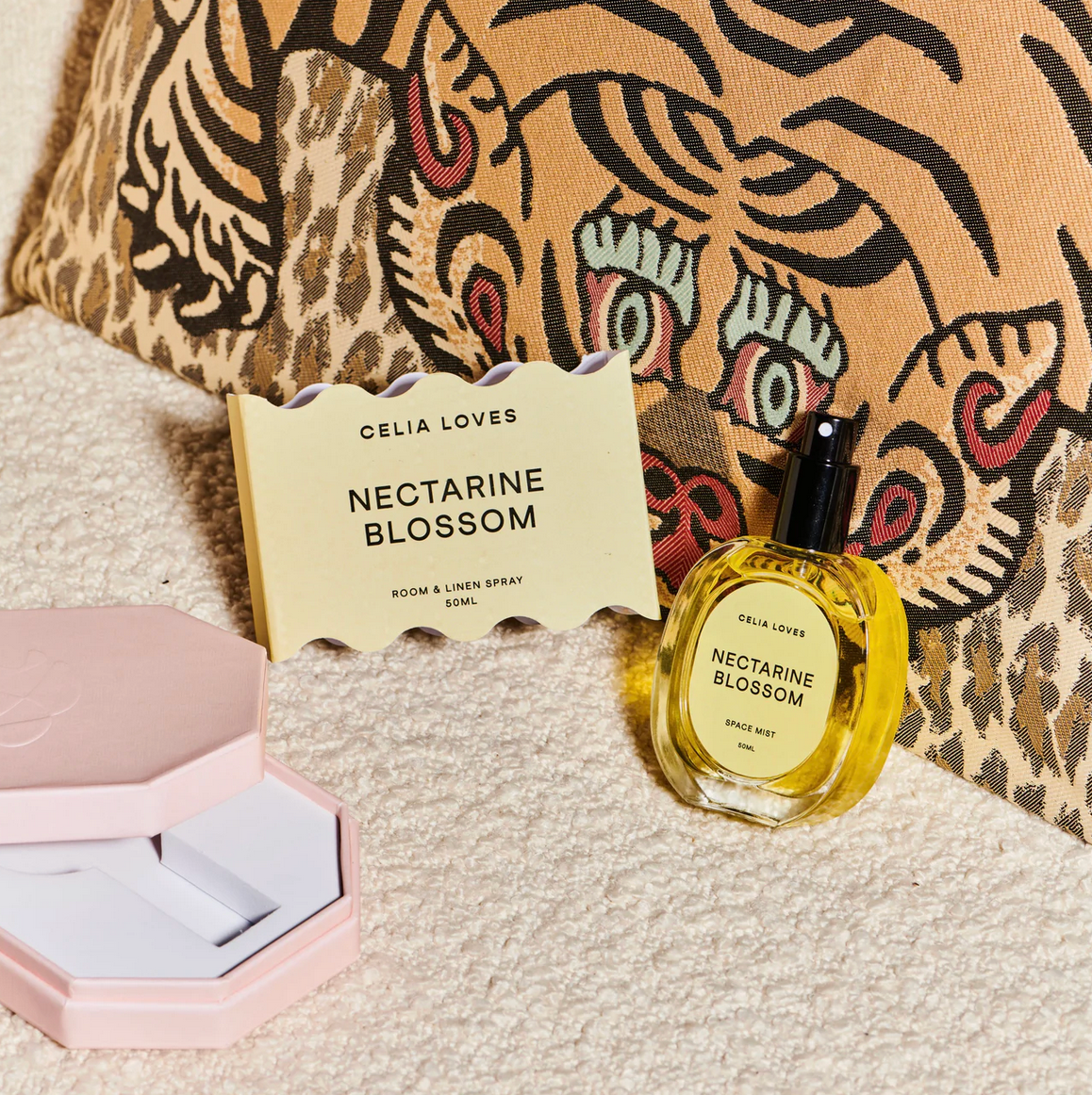 Behind The Trees - Celia Loves Nectarine Blossom room and body spray bottle and packaging on a beige background - Celia Loves - Room Spray 50ml - Nectarine Blossom