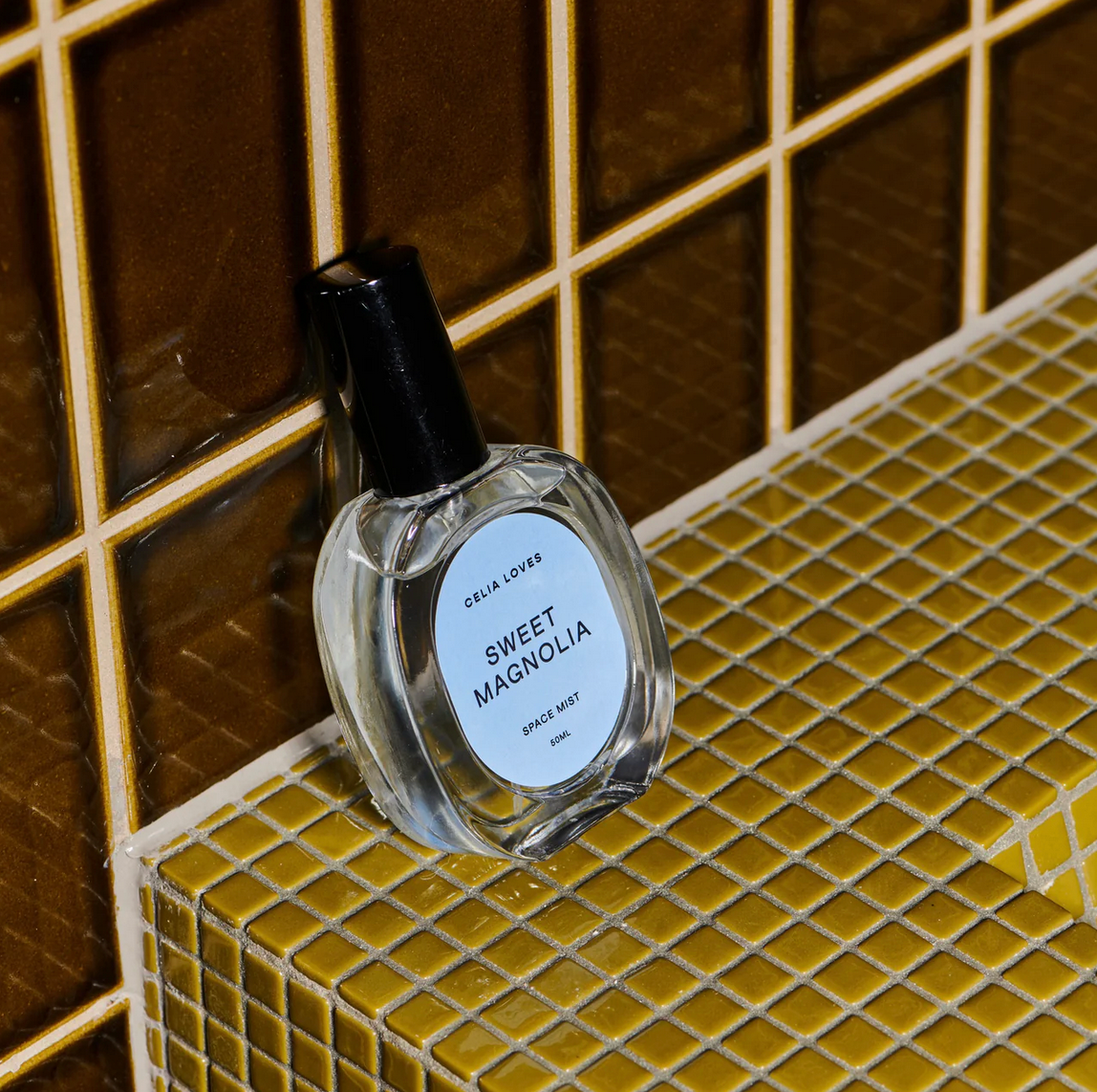 Behind The Trees - Celia Loves Sweet Magnolia room and linen spray with packaging on a beige background - Celia Loves - Room Spray 50ml - Green Moss & Vanilla