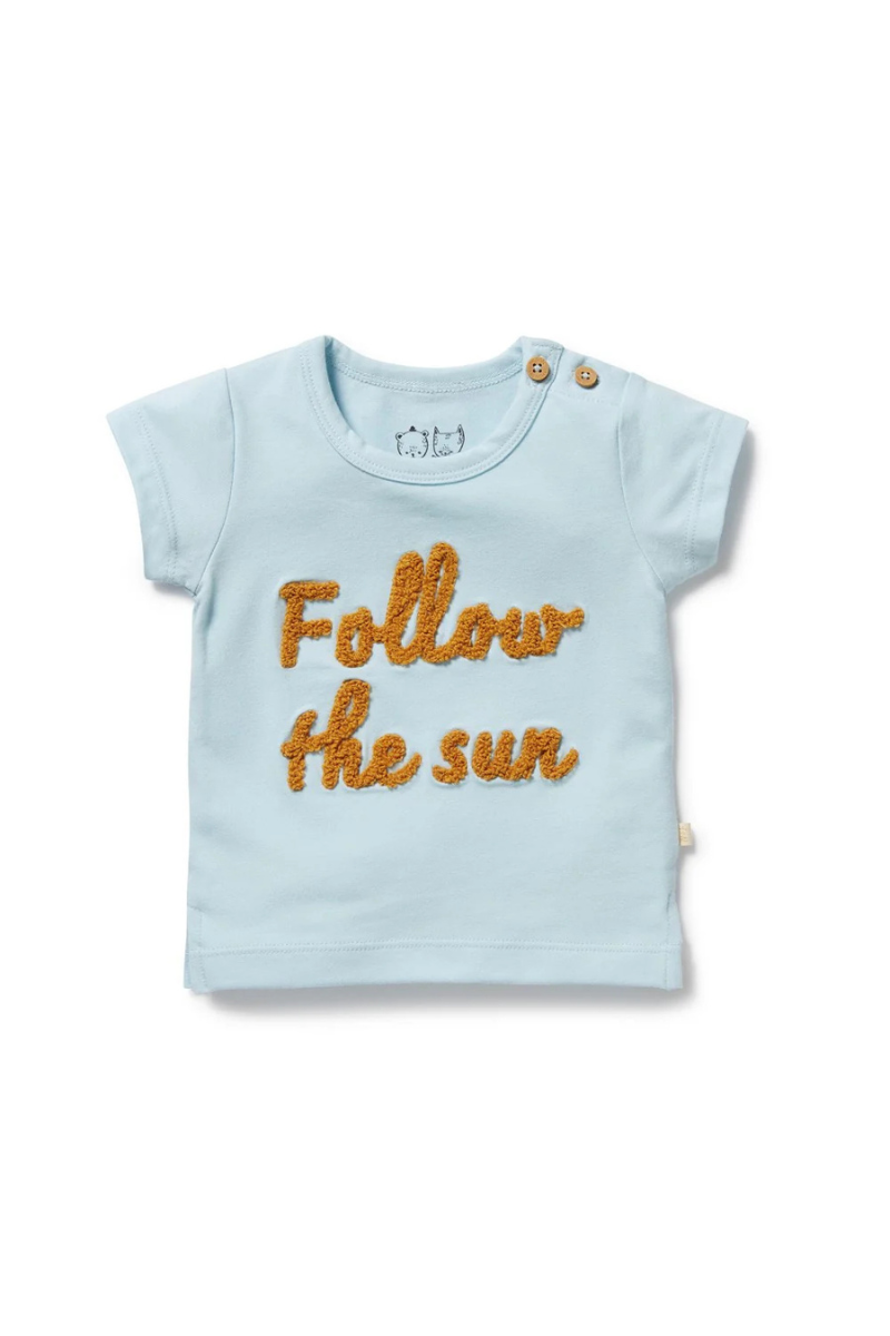 Behind The Trees - Light blue t-shirt with 'Follow the sun' text on a white background - Wilson + Frenchy - Organic Tee - Follow the Sun