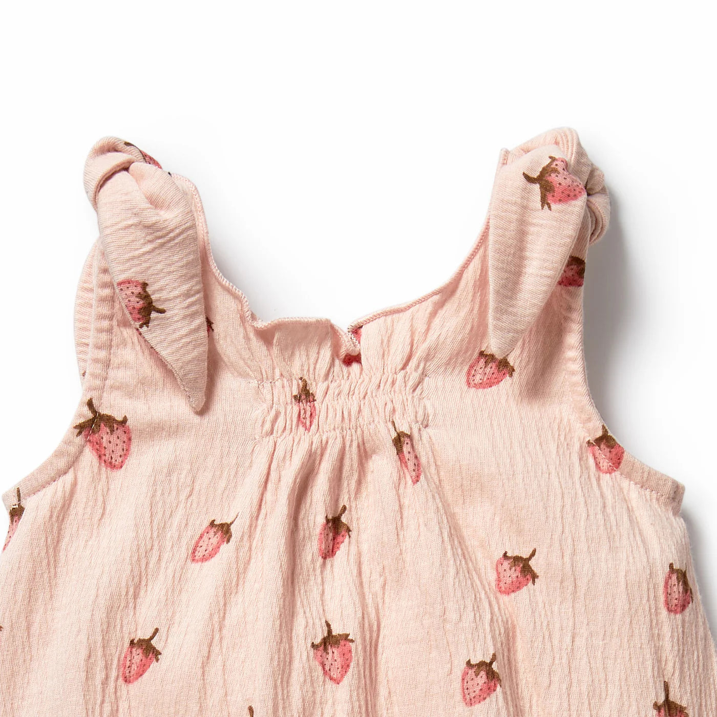 Behind The Trees - Pink baby romper with strawberry pattern on a white background - Wilson + Frenchy - Organic Tie Playsuit - Strawberry Kisses