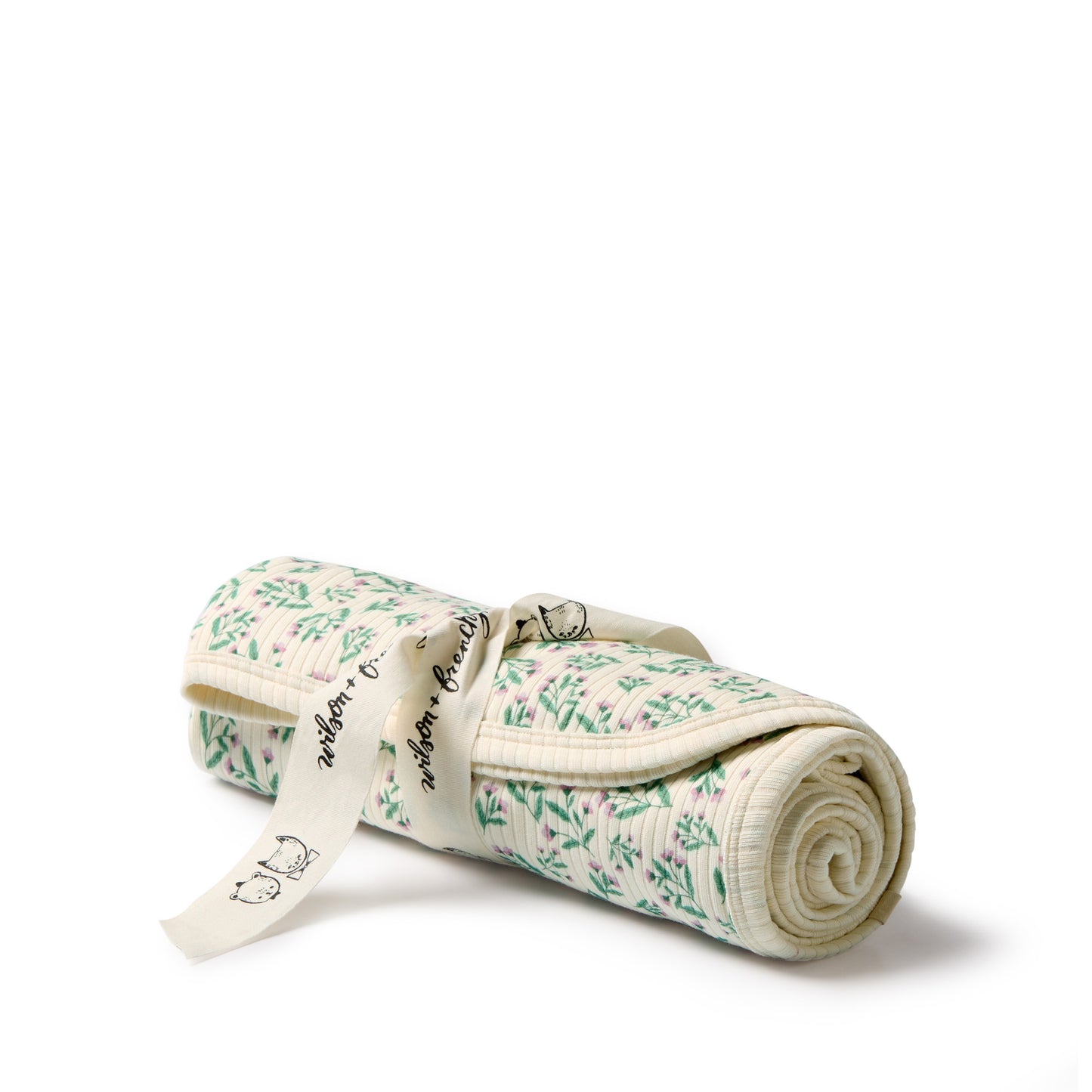 Behind The Trees - Rolled-up fabric with floral pattern on a white background - Wilson + Frenchy - Organic Bunny Rug - Periwinkle