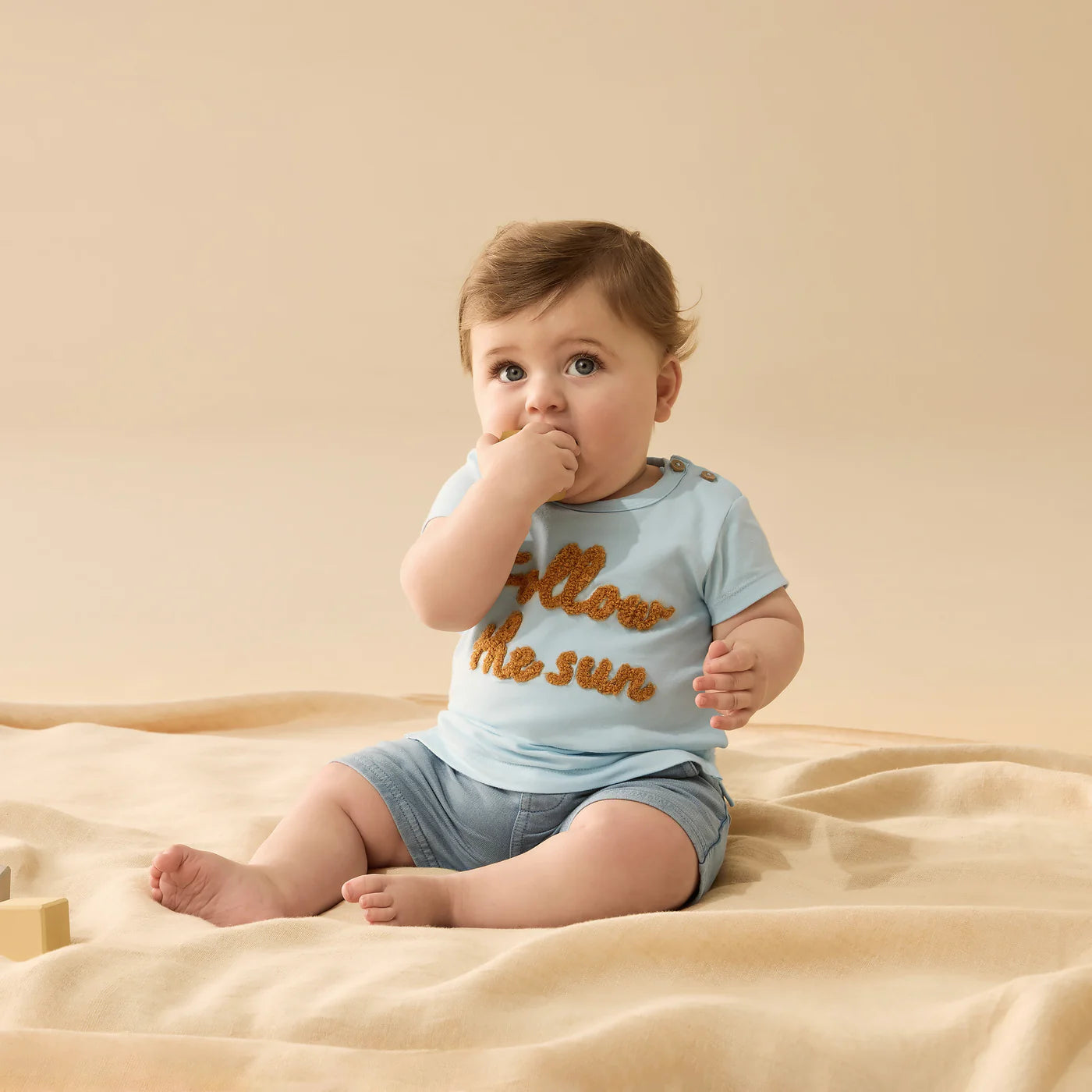Behind The Trees - Light blue t-shirt with 'Follow the sun' text on a white background - Wilson + Frenchy - Organic Tee - Follow the Sun